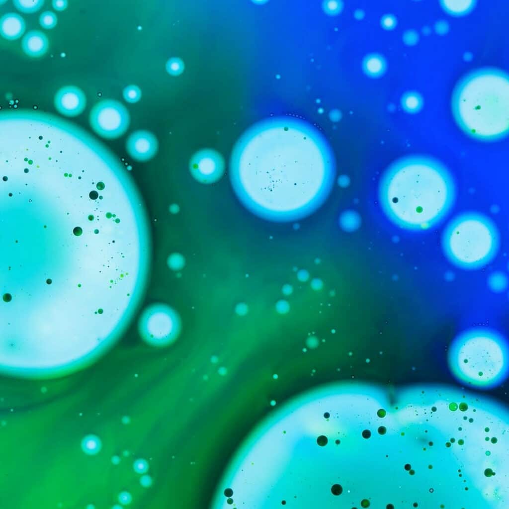 Illustration of bacterias in green and blue. What is microbial aerosol challenge testing. Package integrity testing method. Bacterial contamination, microbial exposure