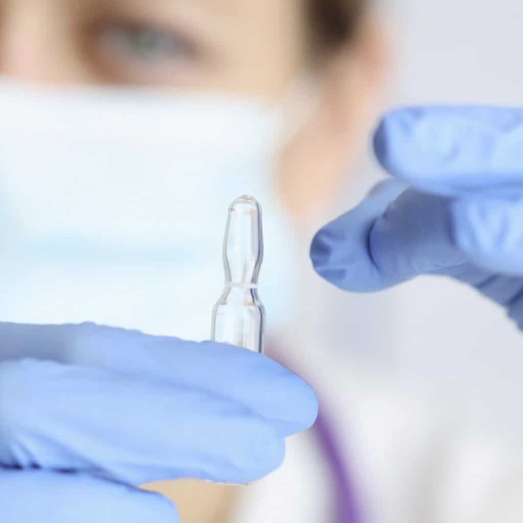 Close picture of a woman technician holding a medical instrument. Stability assays for sterile products. Stability data requirements by FDA development phase. Prefilled injectable products. Stability testing for medical devices. Sterile product types